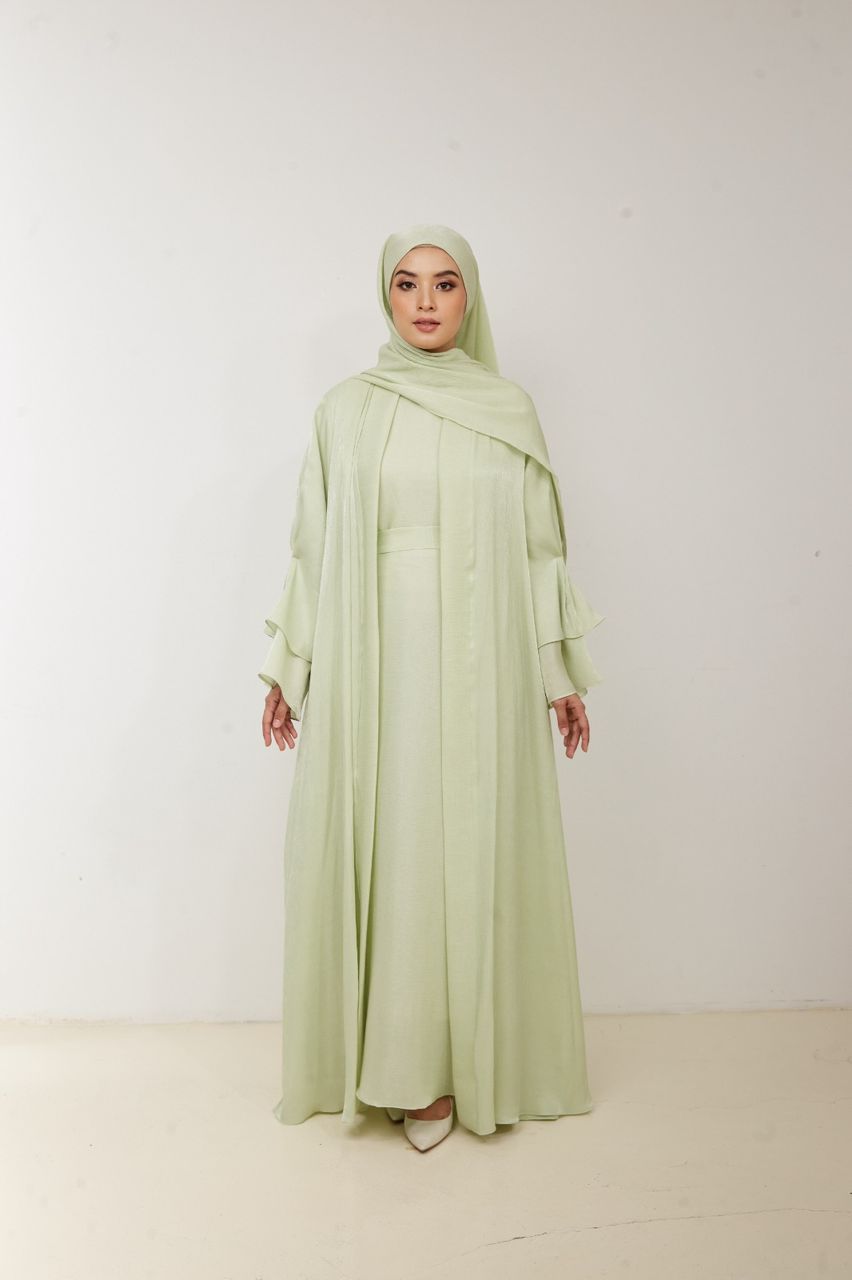 abaya dress green EMERALD ABAYA Emerald green embellished Abaya set with flounced sleeves. Comes with a dress and headscarf. Abayas from Almahra Atelier at Boksha